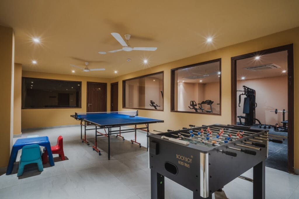a room with a table and ping pong table