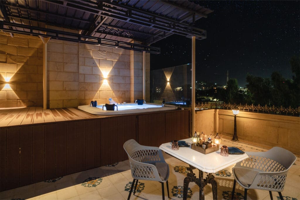 a hot tub on a rooftop at night