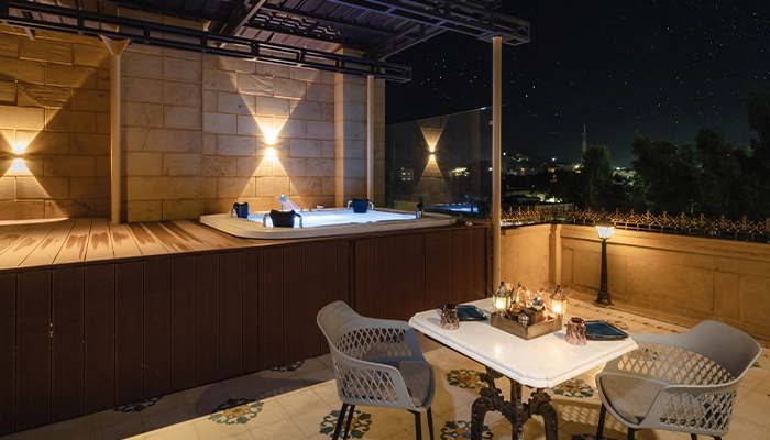 a hot tub on a rooftop at night