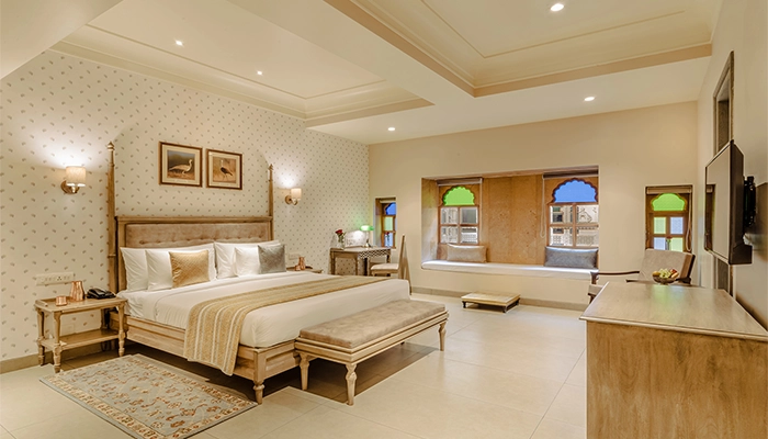 a bedroom with a bed and a table